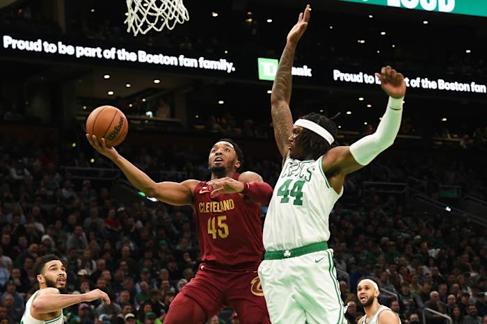 Mar 1, 2023; Boston, Massachusetts, USA; Cleveland Cavaliers guard Donovan Mitchell (45) drives to the basket while Boston Celtics center Robert Williams III (44) defends during the second half at TD Garden. Mandatory Credit: Bob DeChiara-USA TODAY Sports